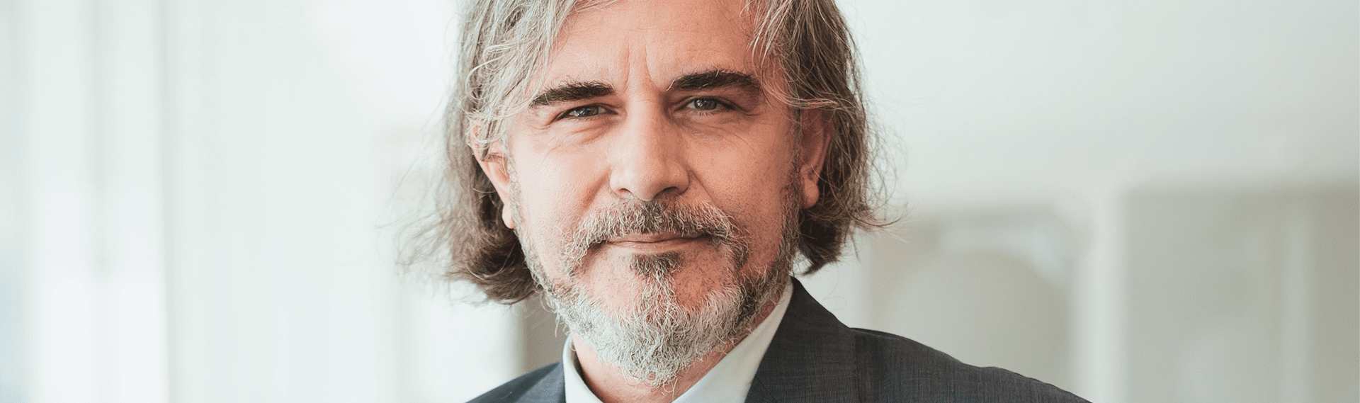 Corporate-Insolvency and business recovery services banner showing an image of a man looking towards the camera