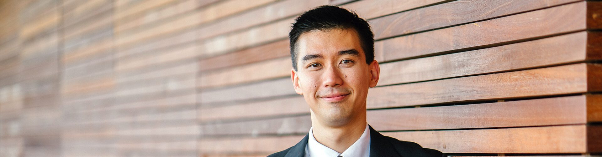 A man in a suit. A member of the business advisory team. Selling a business banner