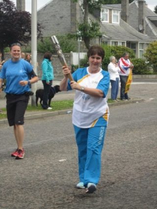 Partner Sheena Anderson in Queen's Baton Relay