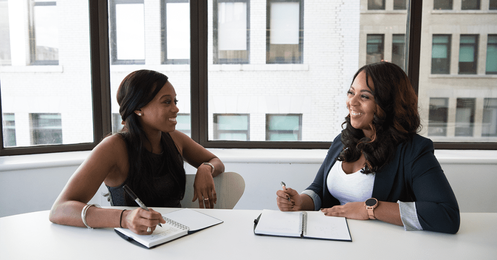 Two professional women talking