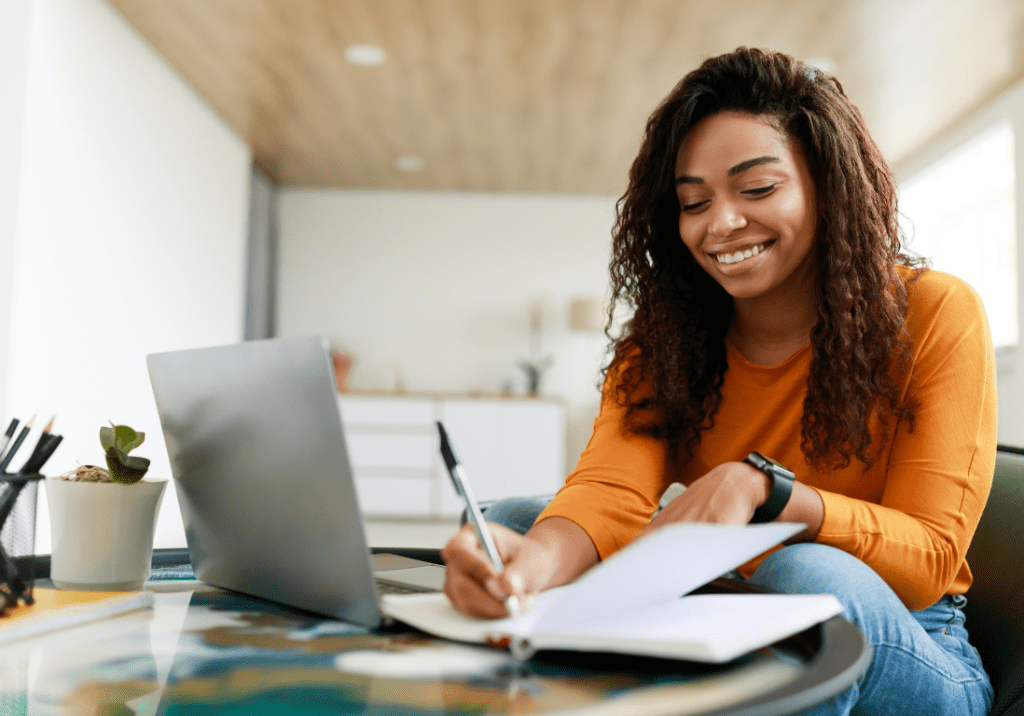 Woman sitting with laptop