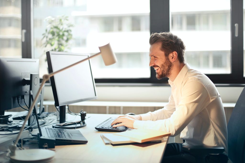 Stock image of man working at computer