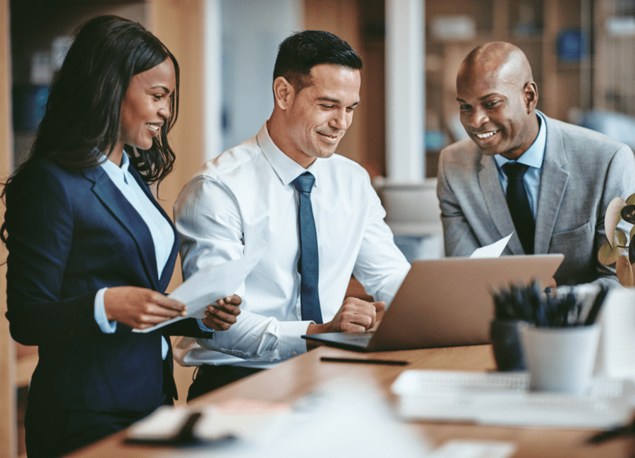 Professionals around a table discussing finance