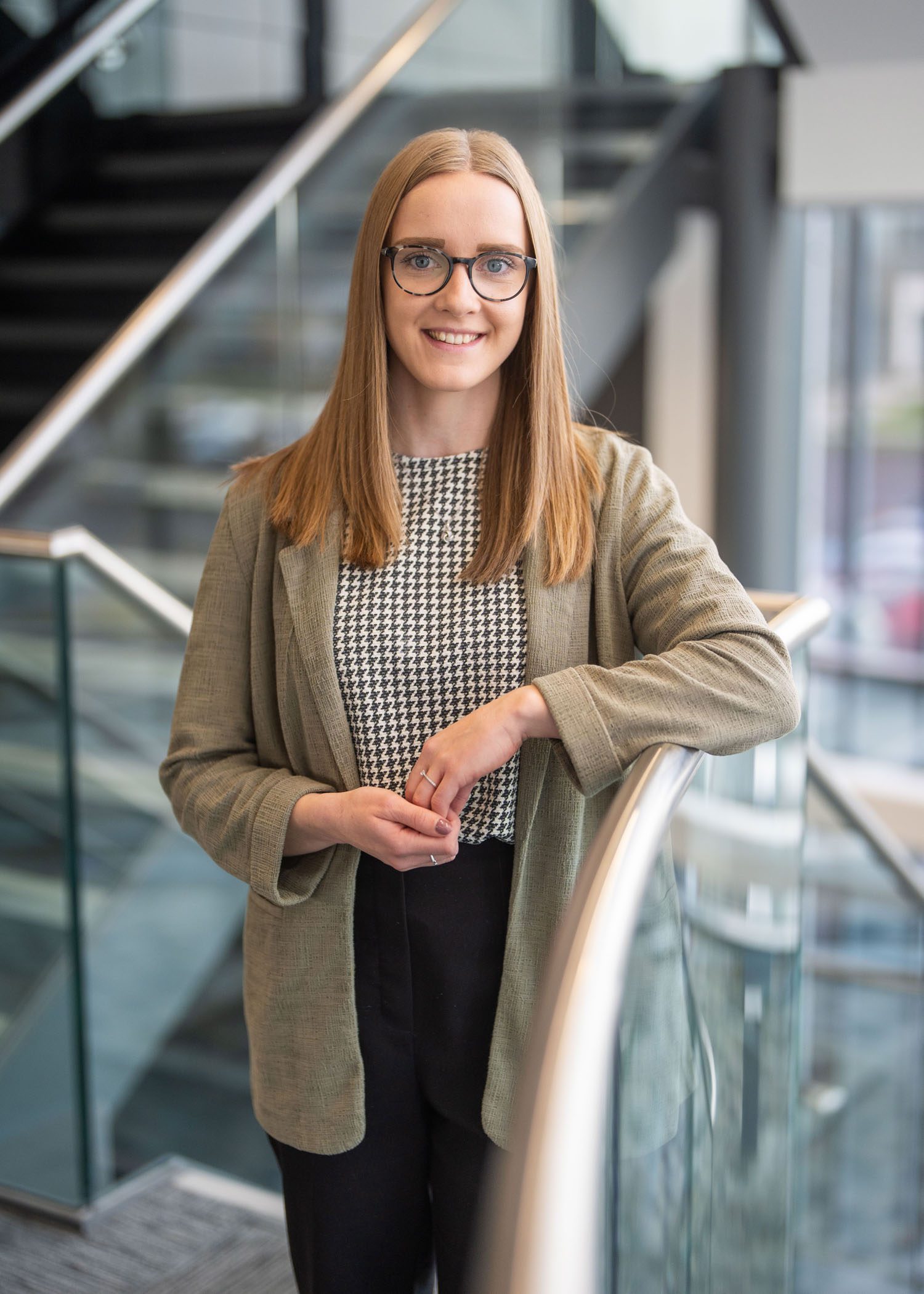 An image of Amber Clouston standing in the Aberdeen office wearing.