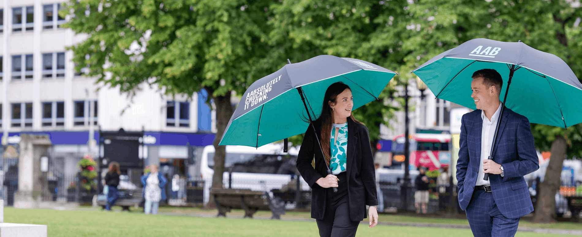 AAB employees with umbrellas.